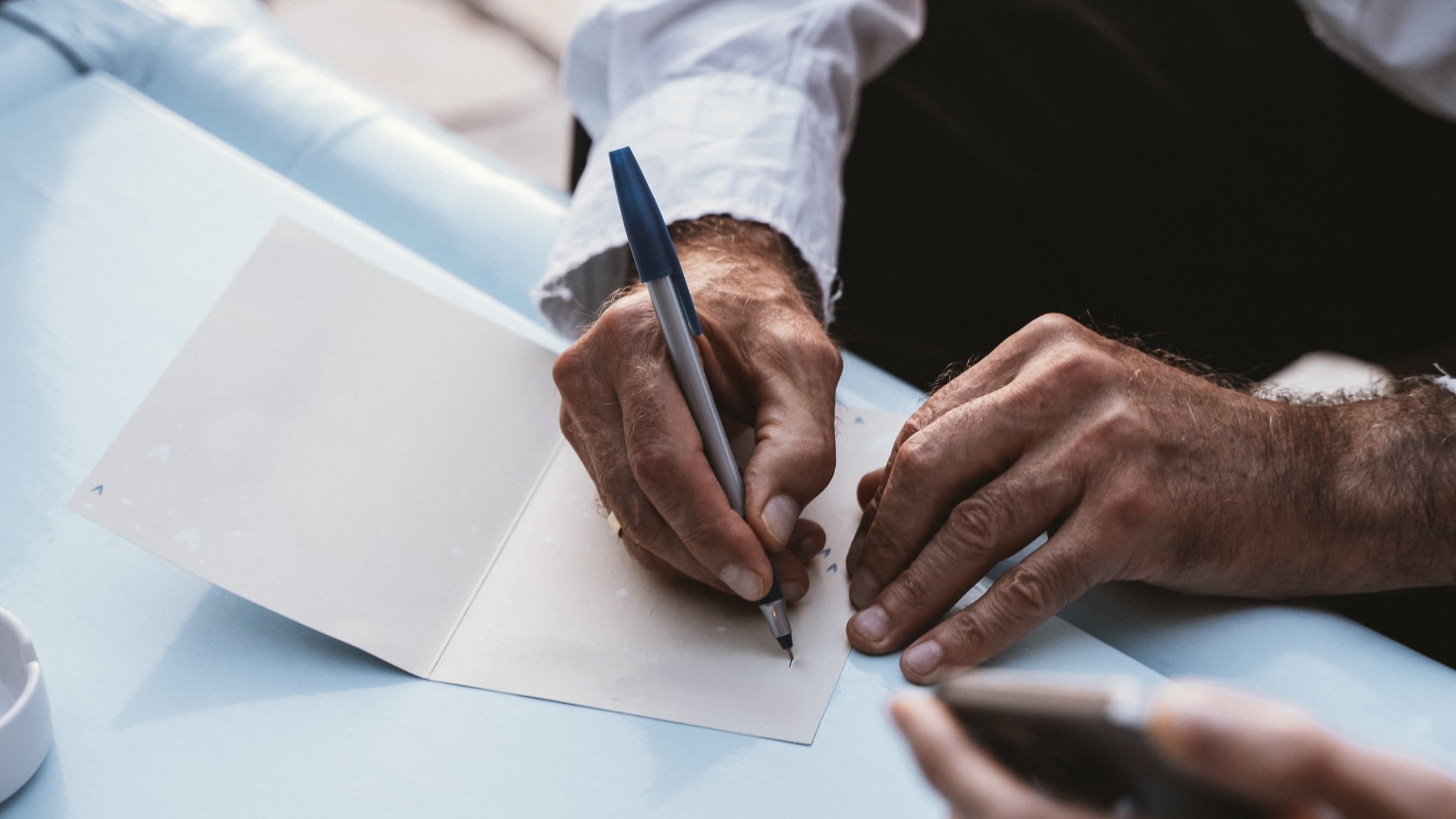 manwritingondocument